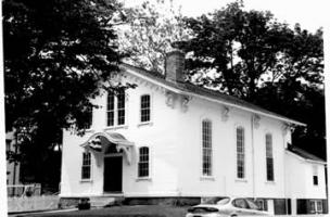 Black and White Photo of Small building with large Windows