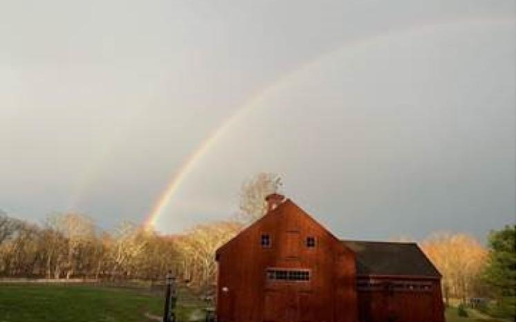 Tapestry Hill Farm: Red Barn with a rainbow in the background
